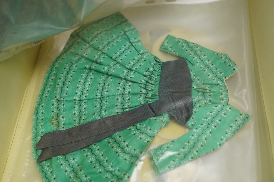 A 1960's Mattel Inc. Barbie doll, 1963, together with a Skipper doll, and a collection of eight original outfits with accessories, sorted into individual packets, outfits purchased between 1963 to 1966 include; American